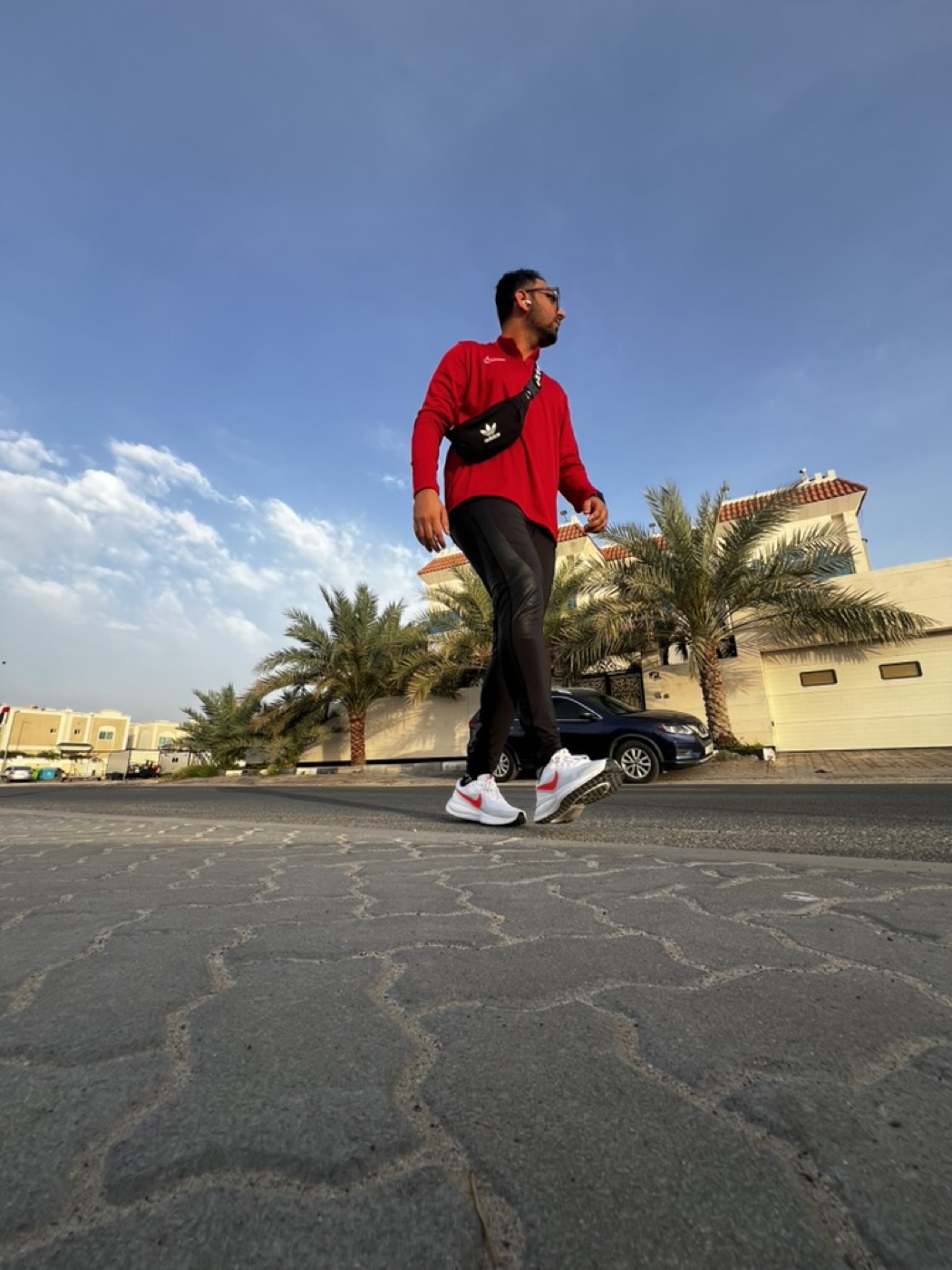 Mid stride in a red jacket